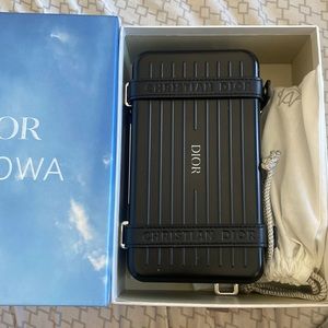 dior rimowa clutch with strap